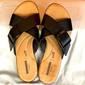 Clark’s slip on black sandals!